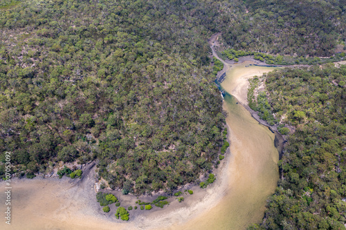 Coastal river through remote Australian bush land aerial