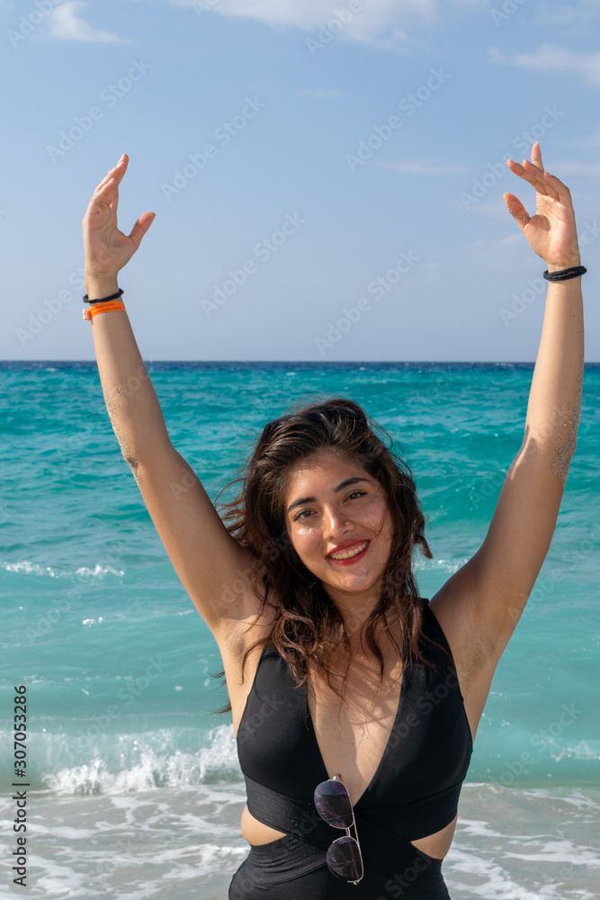 Young woman posing on the beach Young woman posing on the beach