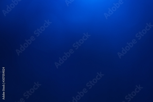 Blue light flare special effect,concert lighting against a dark background ilustration. lens flare