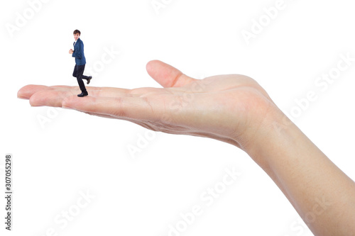 Gigantic woman holding a tiny little businessman as a metaphor for loss of self-confidence.  The man is feeling vulnerable and defenseless isolated on a white background