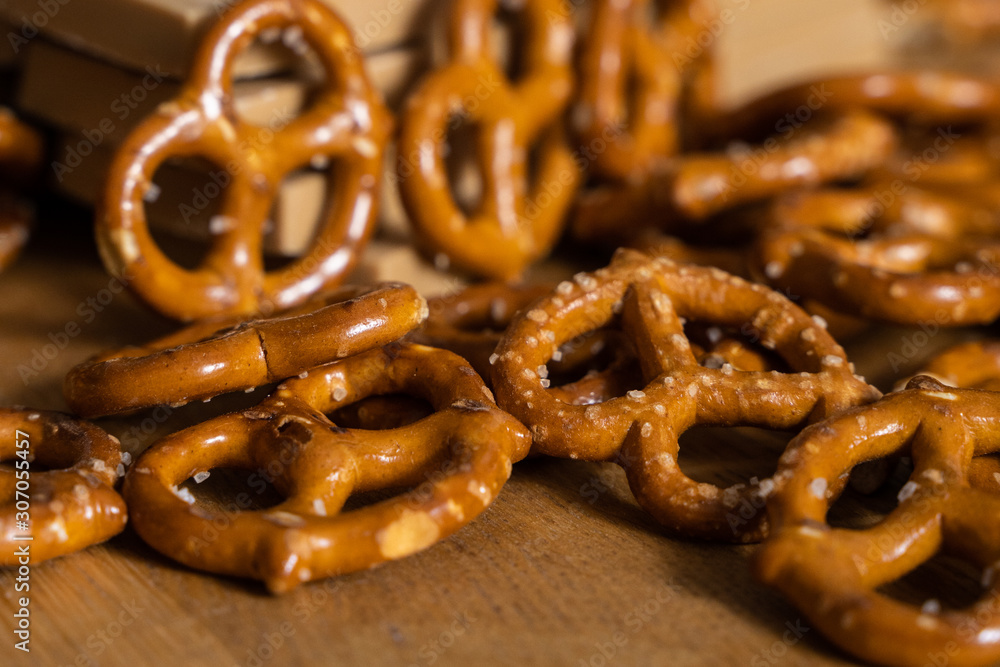 Closeup of Chocolate Hunks and Pretzels on Rustic Wooden Table Top Closeup of Chocolate Hunks and Pretzels on Rustic Wooden Table Top