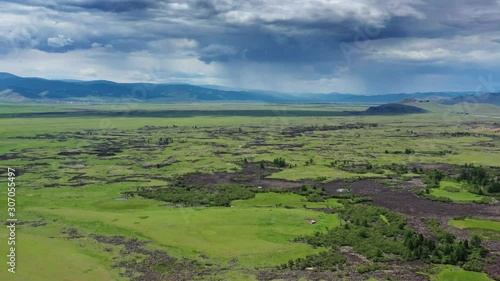 Aerial view of steppe and mountains with rain landscape in Orkhon valley, Mongolia, 4k photo