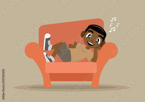 African Boy relaxing at home on sofa.