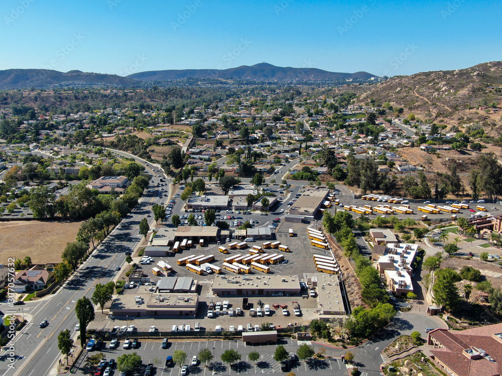 Aerial view of small city Poway in suburb of San Diego County, California, United States. Small road and houses next the valley during dry summer season