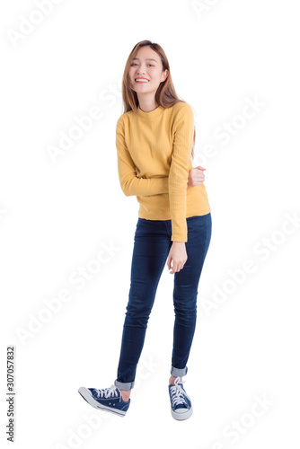 Full length of young asian beautiful girl standing and smiles over white background