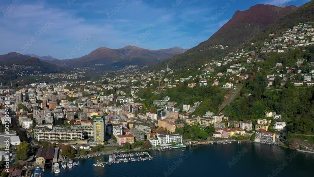 Panoramic view of the city of Lugano and its lakefront on a beautiful sunny October day Panoramic view of the city of Lugano and its lakefront on a beautiful sunny October day