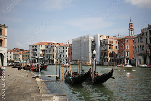 Gondolas travelling on Grand Canal Venice surrounding by historical attractive building, Venice, Italy, Commercial advertisement for day trip boat in Europe © biggereye