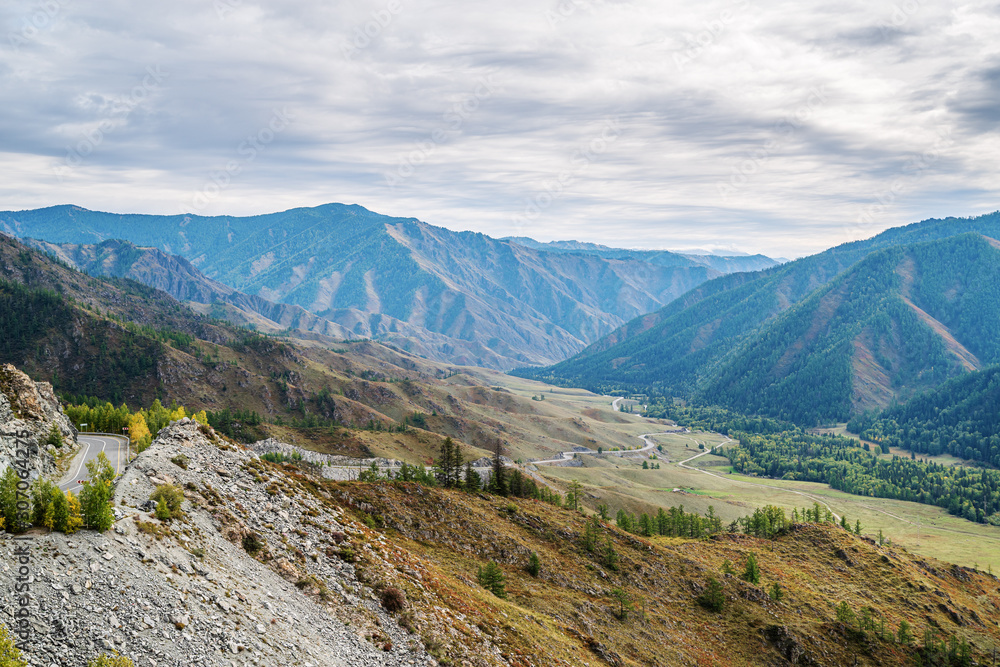 Serpentine mountain road. View of the Chuysky tract from the Chike-Taman pass, Altai mountains, Russia