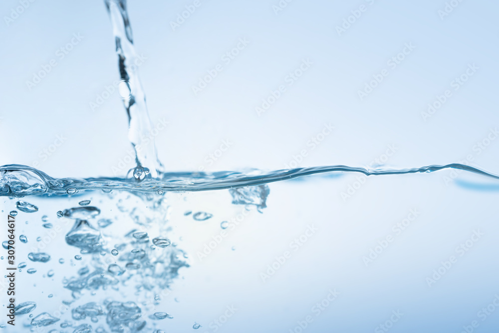 Water splash. Aqua flowing in waves and creating bubbles. Drops on the water surface feel fresh and clean. isolated on white background. Water splash. Aqua flowing in waves and creating bubbles. Drops on the water surface feel fresh and clean. isolated on white background.