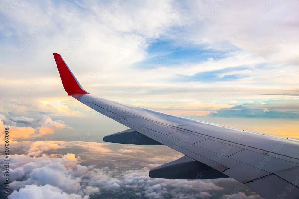 Morning sunrise with Wing of an airplane. Photo applied to tourism operators and fast and efficient transportation. picture for add text message or art work frame website. Traveling concept. Morning sunrise with Wing of an airplane. Photo applied to tourism operators and fast and efficient transportation. picture for add text message or art work frame website. Traveling concept.