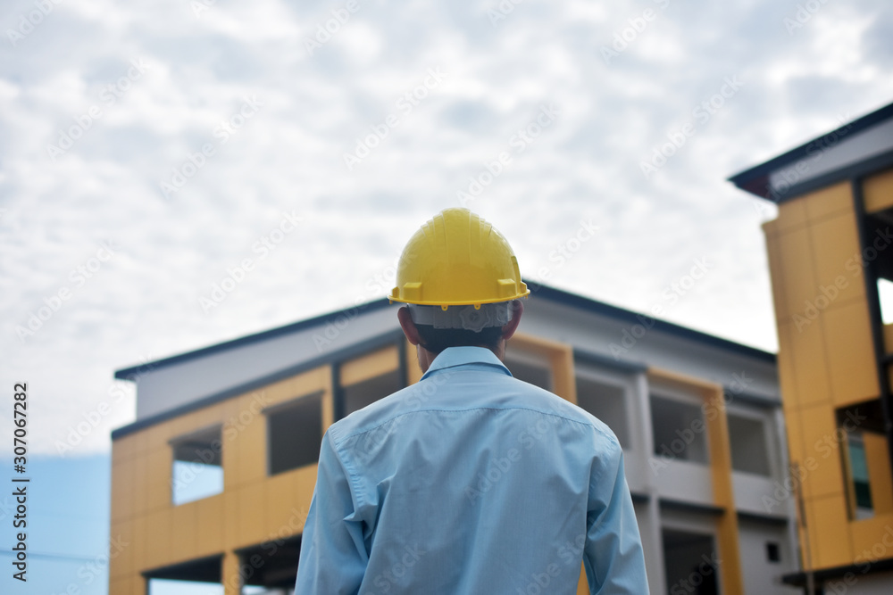 Engineer standing worker building estate construction background Engineer standing worker building estate construction background
