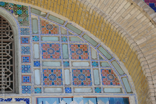 The ceiling in the form of a dome in a traditional ancient Asian mosaic. The details of the architecture of medieval Central Asia