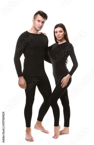 Couple wearing thermal underwear isolated on white
