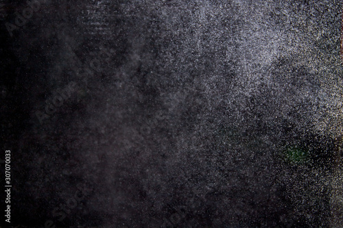 Abstract dust explosion on a black background