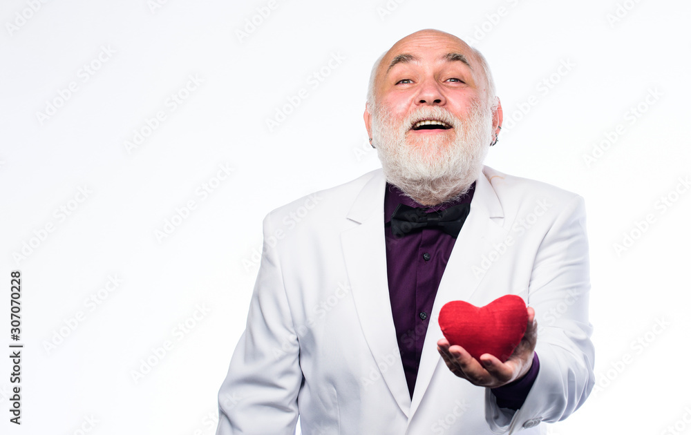 Health care treatment. problems with heart. World heart day. valentines day. donor transplant. love and romance. bearded businessman. heart failure. happy mature man hold red heart. What to expect Health care treatment. problems with heart. World heart day. valentines day. donor transplant. love and romance. bearded businessman. heart failure. happy mature man hold red heart. What to expect