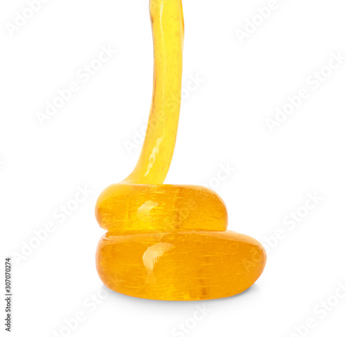 Flowing orange slime on white background. Antistress toy photo