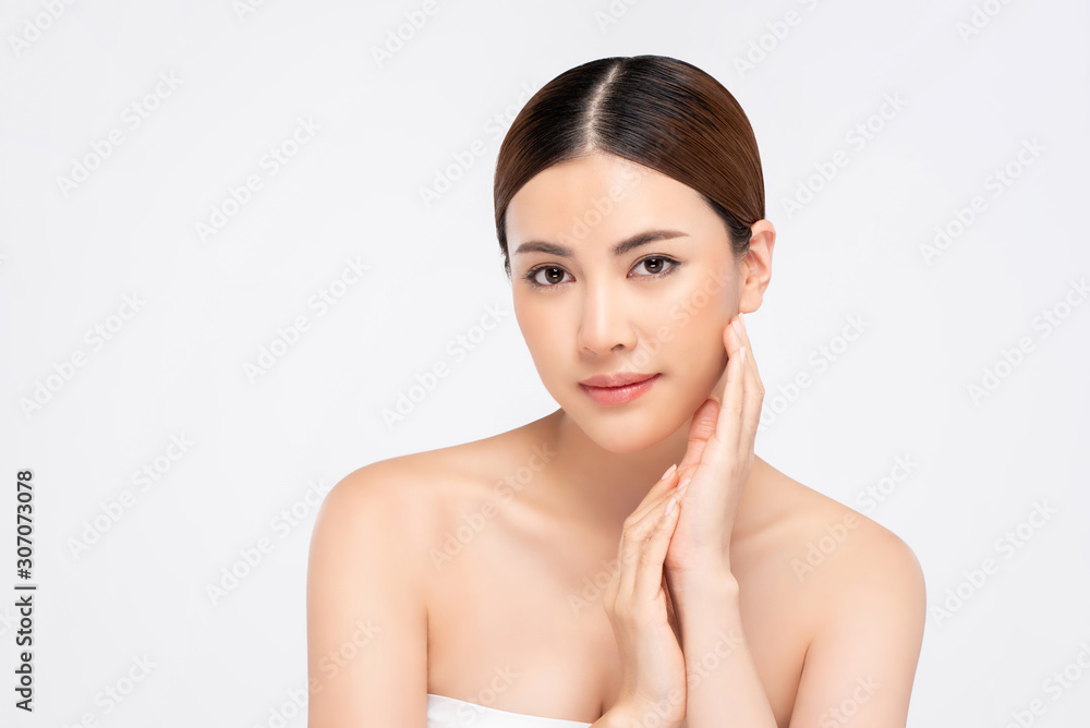 Beauty shot of youthful bright skin pretty Asian woman with hand touching face Beauty shot of youthful bright skin pretty Asian woman with hand touching face
