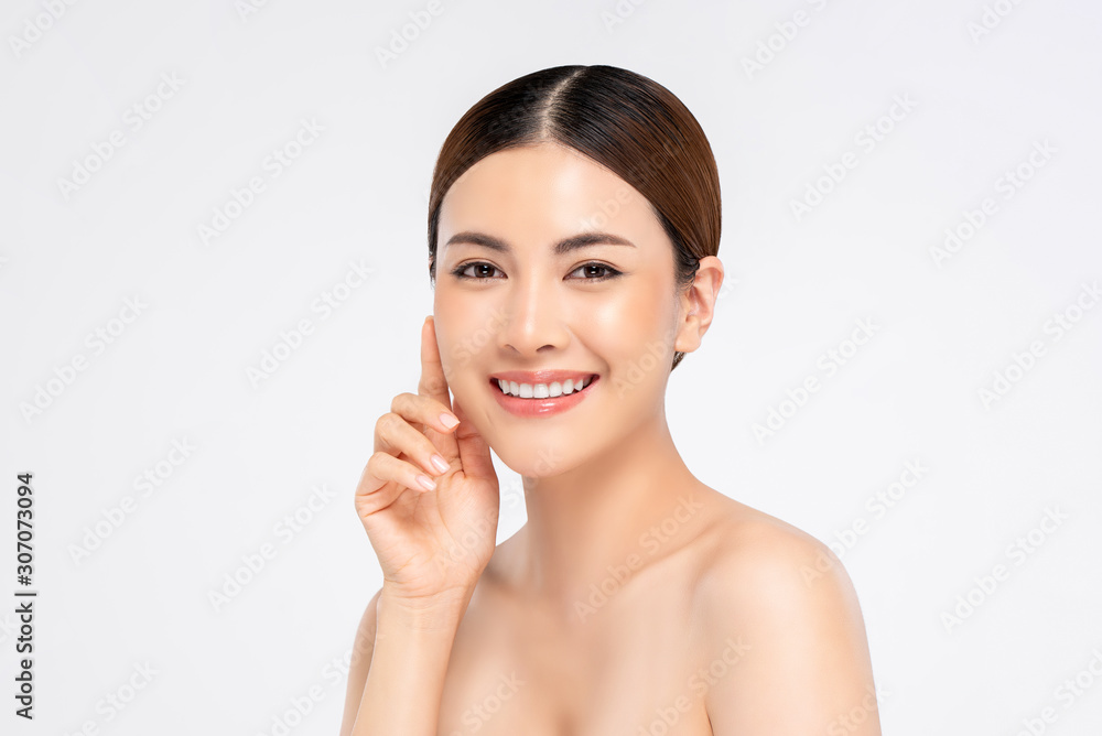 Youthful smiling pretty Asian woman with hand touching face on white background Youthful smiling pretty Asian woman with hand touching face on white background