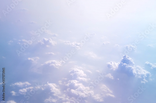 Soft focus of cloudscape or white cloud and blue sky from window of air plane.