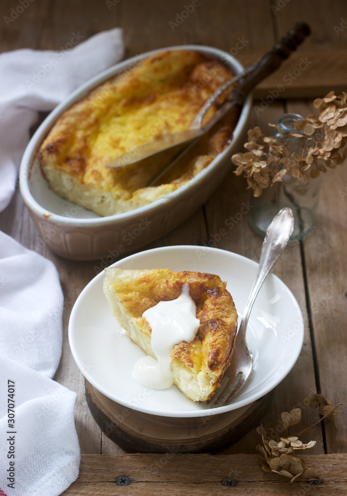 Banitsa, a traditional Bulgarian or Balkan filo pastry pie stuffed with feta cheese, sour milk and eggs. Rustic style. Banitsa, a traditional Bulgarian or Balkan filo pastry pie stuffed with feta cheese, sour milk and eggs. Rustic style.