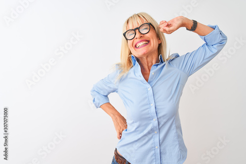 Middle age businesswoman wearing elegant shirt and glasses over isolated white background stretching back  tired and relaxed  sleepy and yawning for early morning