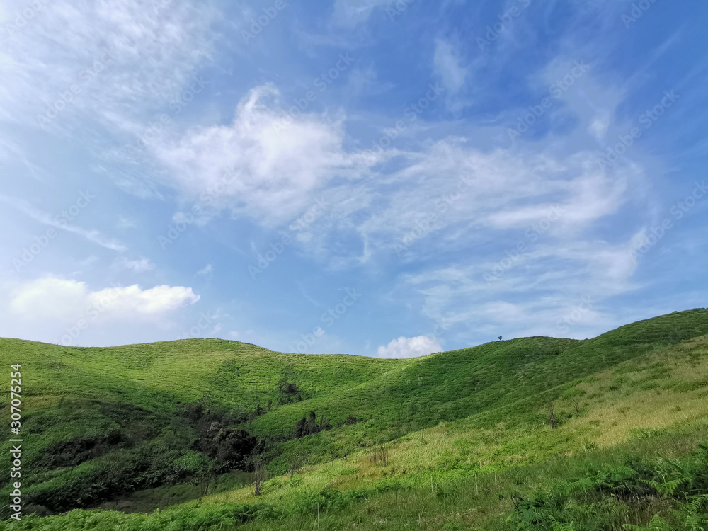 Blue sky with cloud and mountain.