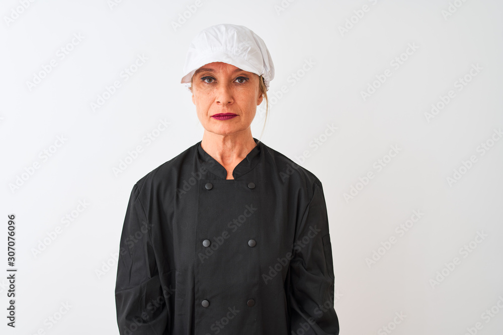Middle age chef woman wearing uniform and cap standing over isolated white background with serious expression on face. Simple and natural looking at the camera. Middle age chef woman wearing uniform and cap standing over isolated white background with serious expression on face. Simple and natural looking at the camera.