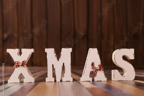 Christmas time banner template on wooden background. New Year decoration. Xmas white word. Flat-lay. New Year concept. photo