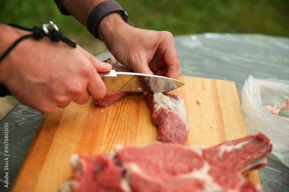 raw beef meat on a cutting board