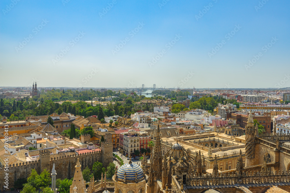 The view of Seville from the height of the Giralda tower of Cathedral on a sunny day.