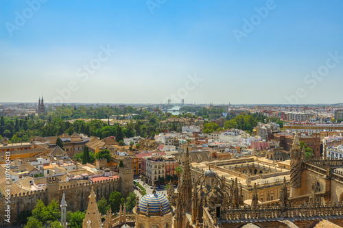 The view of Seville from the height of the Giralda tower of Cathedral on a sunny day.