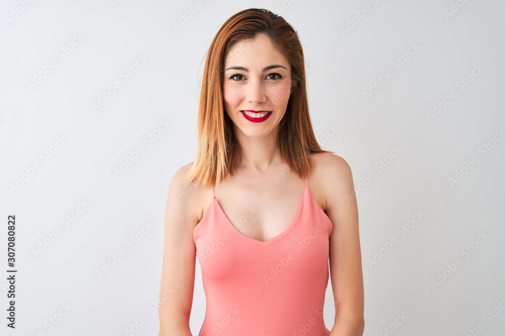 Φωτογραφία Beautiful redhead woman wearing casual pink t-shirt standing over isolated white background with a happy and cool smile on face