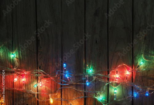 Christmas rustic background - old wood with lights and free text
