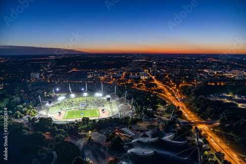 Nächtlicher Blick über München, den Olympiapark und das erleuchtete Olympiastadion photo