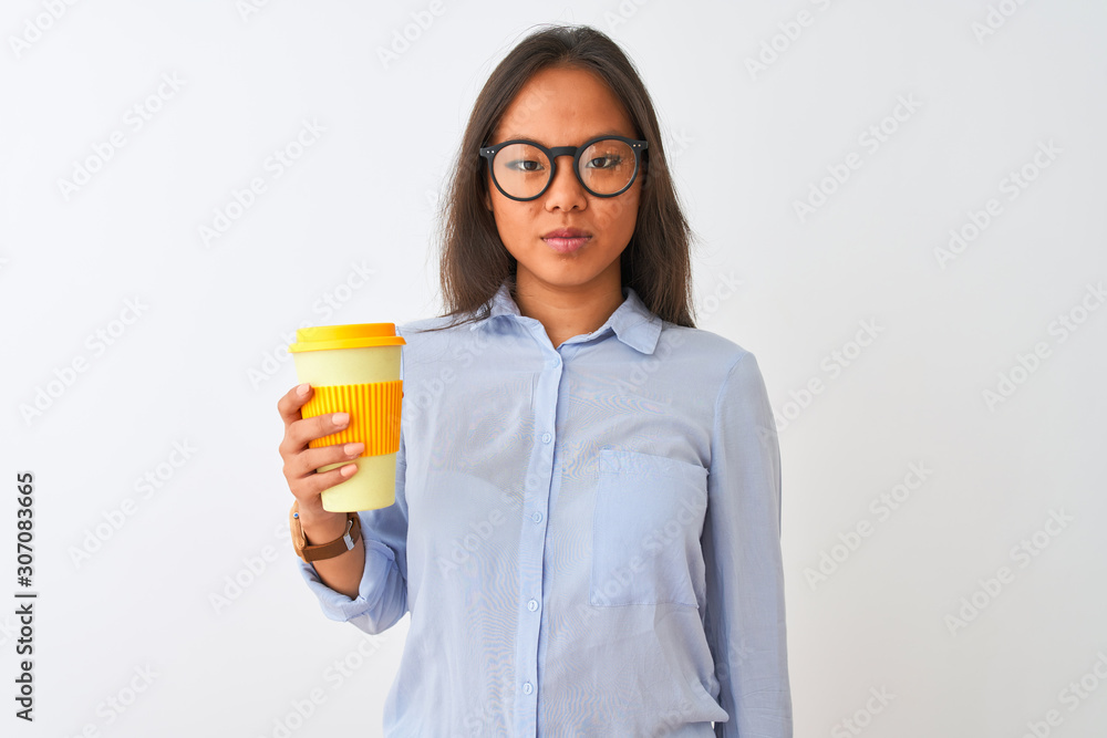 Young chinese woman wearing glasses holding glass of coffee over isolated white background with a confident expression on smart face thinking serious Young chinese woman wearing glasses holding glass of coffee over isolated white background with a confident expression on smart face thinking serious