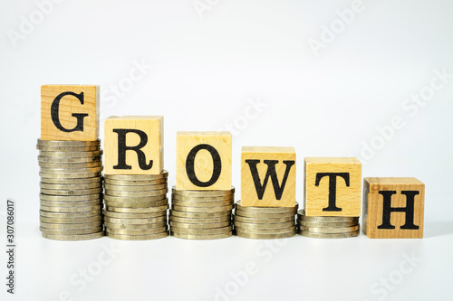 Business concept of growth on investment on white background, Stack coins and text box.