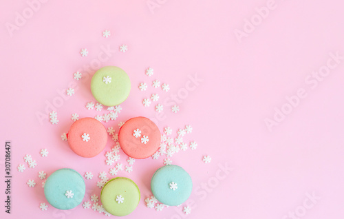 Christmas tree from macaroons on pink background, creative colorful concept of New Year and Christmas