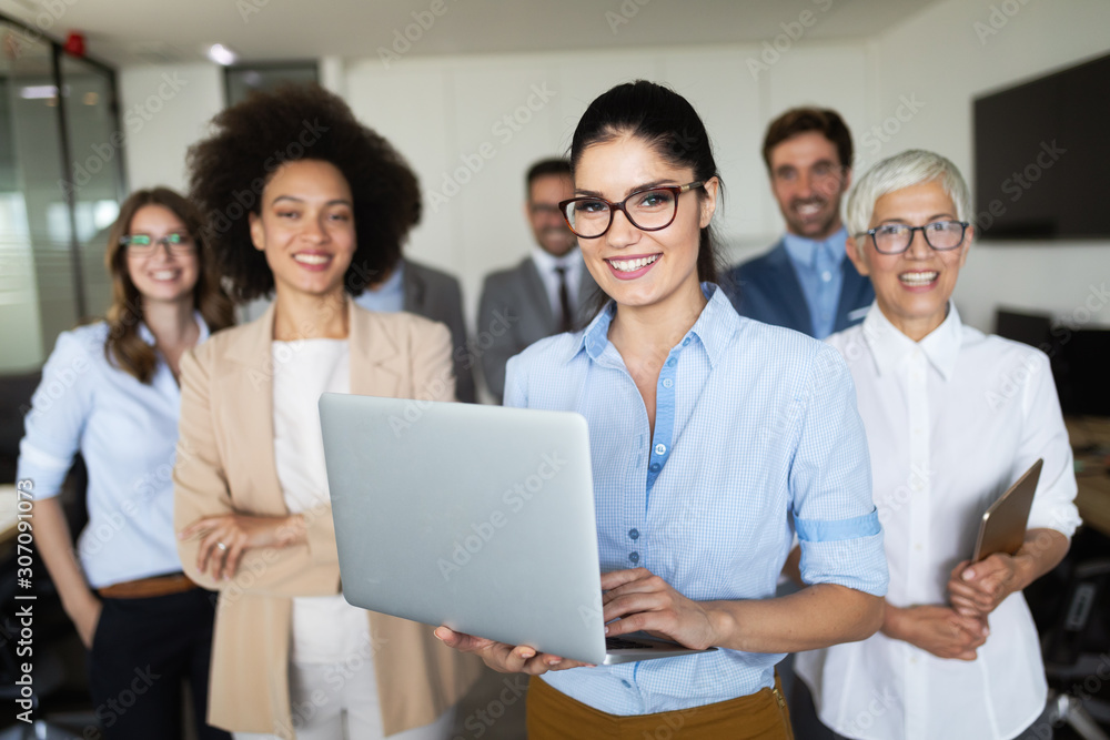 Group of successful business people at work in office Group of successful business people at work in office