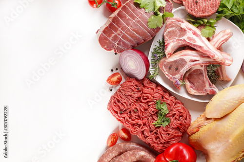 assorted of raw meats, beef- sausage- chicken isolated on white background