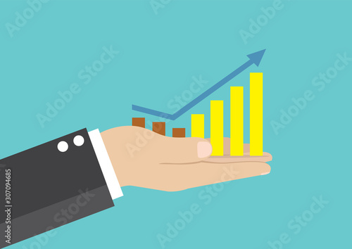 Businessman holds in hand a business graph.