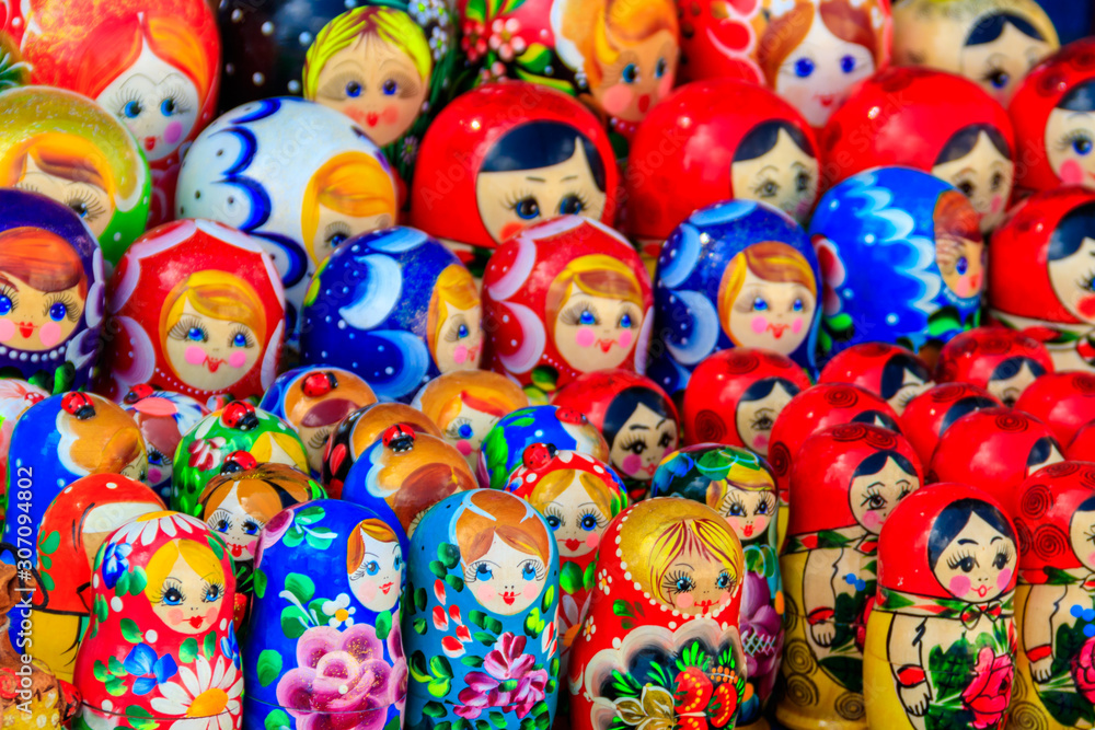 Fototapeta premium Traditional souvenirs from Russia - colorful nesting dolls, also known as matryoshka, babushka, stacking dolls, or Russian dolls