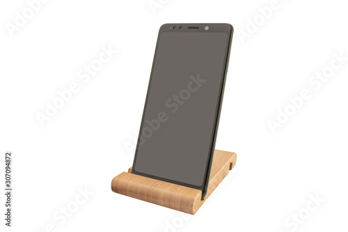 Smartphone on a wooden stand with place for text on display isolated. Modern Mockup of a mobile phone with a dark display. Environmental stands for fixing smartphones. Copy space.