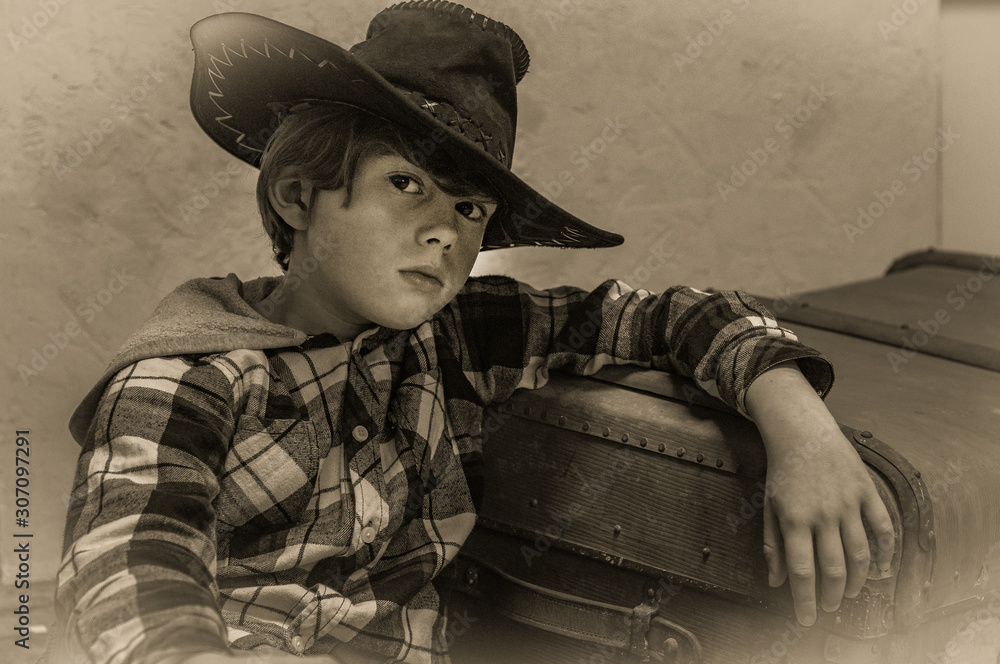 cowboy hat and a plaid shirt of blond 