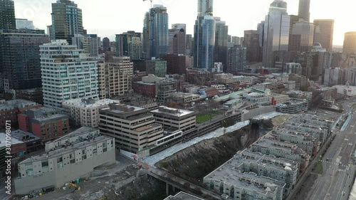 Drone footage of Seattle downtown, from waterfront, Alaskan Way with skyscrapers at dawn photo