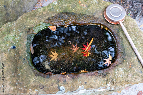 Hand basin at a small shrine in the mountain in Japan photo