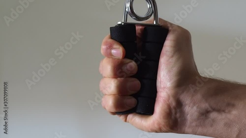 Manual hand gripper for forearm strength development