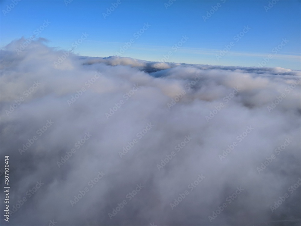 Fototapeta premium Aerial photography of landscape with clouds and blue sky