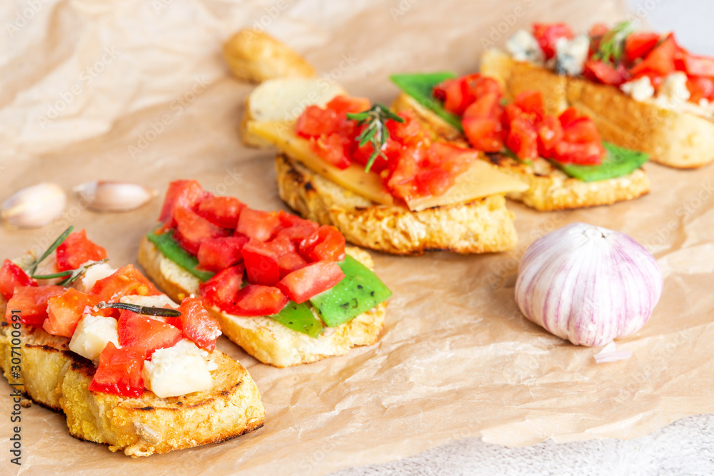 Italian bruschetta with cheese and tomatoes Italian bruschetta with cheese and tomatoes