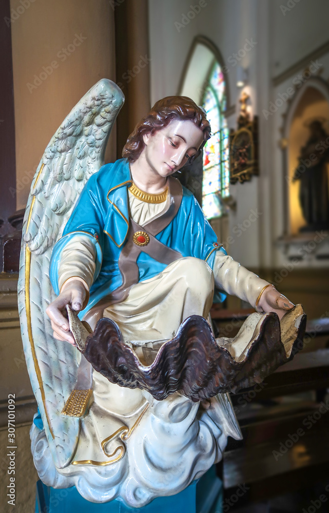 BANGKOK, THAILAND – 16 JULY 2019: Holy water font at Holy Rosary Church, Bangkok, Thailand BANGKOK, THAILAND – 16 JULY 2019: Holy water font at Holy Rosary Church, Bangkok, Thailand