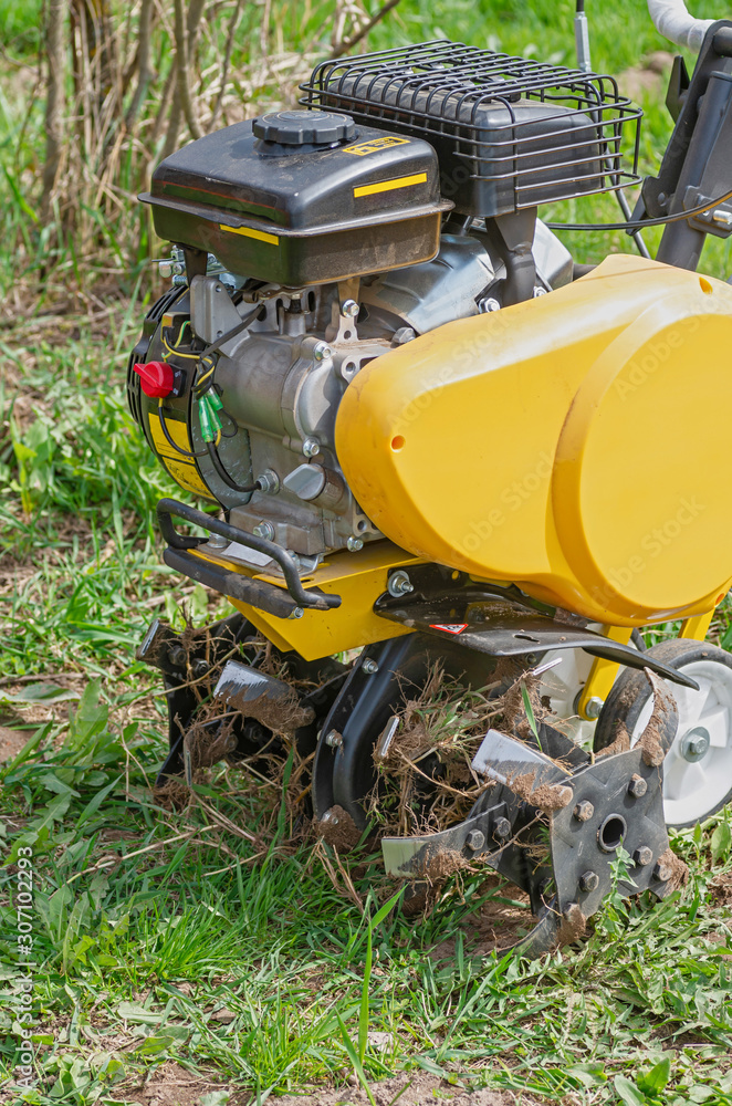 Cultivator for tillage in the garden,motor cultivator. Close-up.